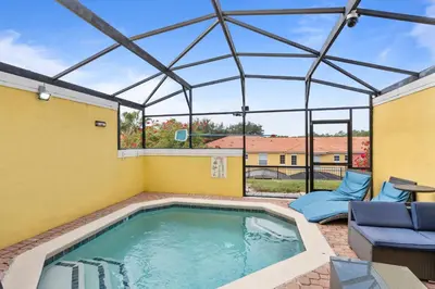 a swimming pool with a glass roof at Cozy 3Bdrms At Encantada- 6 miles from Disney in Kissimmee