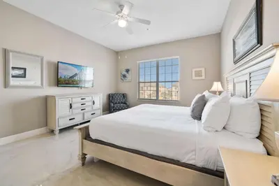 a bedroom with a bed and a ceiling fan at 4804 Cayview Avenue 401 in Orlando