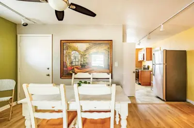 a kitchen and dining room with a table and chairs at 3-Bed Bungalow walk to Historic Downtown Sanford in Sanford