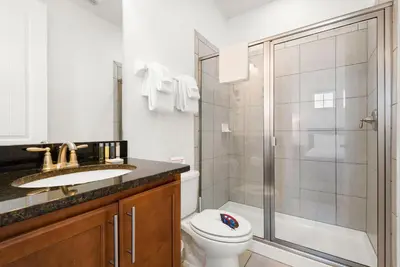 a bathroom with a shower and a toilet and a sink at Delightful Home Near Disney With Private Pool And Waterpark & Resort Access At Encore Resorts Reunion - 441No in Kissimmee