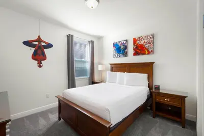 a bedroom with a large bed and a window at Delightful Home Near Disney With Private Pool And Waterpark & Resort Access At Encore Resorts Reunion - 441No in Kissimmee