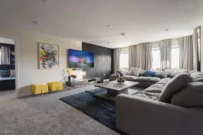 a living room with a couch and a table at 7 BR Large Pool Game Room @ Storey Lake SL2861 in Kissimmee