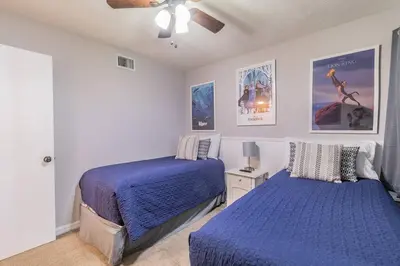 a bedroom with two beds and a ceiling fan at LOVE AT FIRST SIGHT! NEW Disney Home, Sleeps 6, Pool, Patio, NO Steps, LOW Rates! in Kissimmee