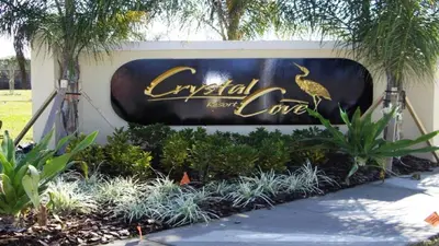 a sign for a resort with a peacock on it at Shvcc2 - Crystal Cove #2 - 7 Bed 45 Baths Villa in Kissimmee