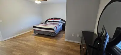 a bedroom with a bed in the corner of a room at Shvpc3 - Paradise Cay #3 - 3 Bed 25 Baths Townhome in Kissimmee