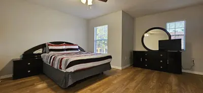 a bedroom with a bed with a mirror and a dresser at Shvpc3 - Paradise Cay #3 - 3 Bed 25 Baths Townhome in Kissimmee