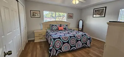 a bedroom with a bed and a dresser and a window at Shvpc3 - Paradise Cay #3 - 3 Bed 25 Baths Townhome in Kissimmee