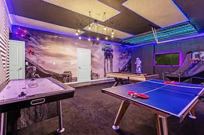 a ping pong room with two ping pong tables at 15BR Mansion Home with Pool & Hot Tub-near Disney in Kissimmee