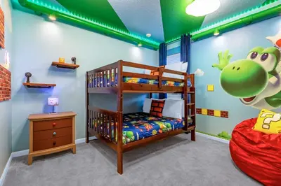 a childs room with a bunk bed and a green monster mural at 15BR Mansion Home with Pool & Hot Tub-near Disney in Kissimmee