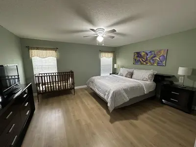 a bedroom with a bed and a ceiling fan at Paradise Palms Resort - 6 Bed 5 Baths Villa in Kissimmee