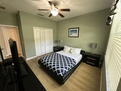 a bedroom with a bed and a ceiling fan at Paradise Palms Resort - 6 Bed 5 Baths Villa in Kissimmee