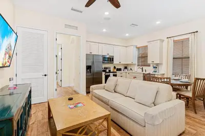 a living room with a couch and a table at 3000 Latitude Lane in Orlando