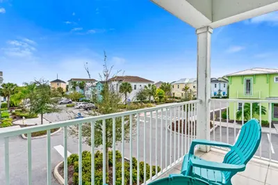 a blue chair on a balcony with a view of a street at 3000 Latitude Lane in Orlando
