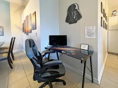 a office with a desk and a chair and a computer at Callaghan Cantina home in Orlando