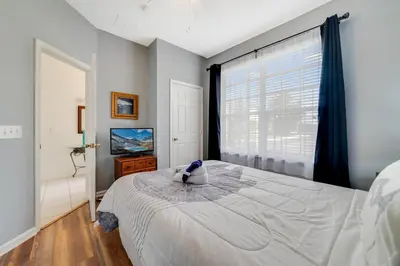 a bedroom with a large bed and a window at Windsor Hills Townhome in Orlando