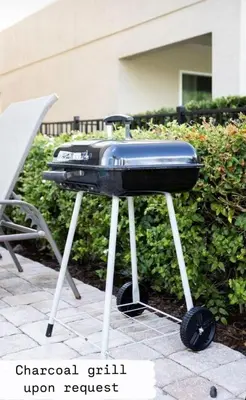 a bbq grill sitting on top of a table at 541 Villa- 7BD Dream Home - Private PoolSpa in Orlando