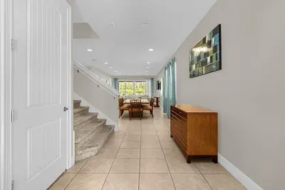 a hallway of a home with a staircase and a table at 541 Villa- 7BD Dream Home - Private PoolSpa in Orlando