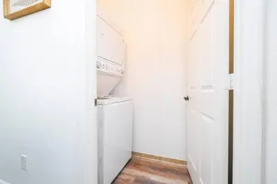 a white laundry room with a washer and dryer at Your Orlando home 15 min to Disney - KGG01 in Kissimmee