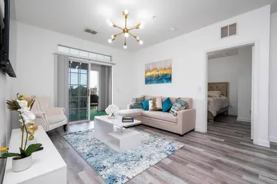 a living room with a couch and a table at Your Orlando home 15 min to Disney - KGG01 in Kissimmee