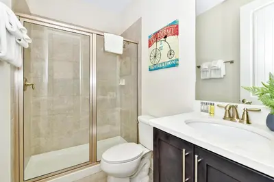 a bathroom with a shower and a toilet and a sink at Lovely Home Near Disney With Private Pool, Water Park & Resort Access At Encore Resort Reunion - 7423Mr in Kissimmee