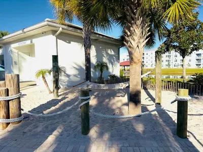 a patio with palm trees and a building at Magical Themed Home - Disney 15 min in Kissimmee