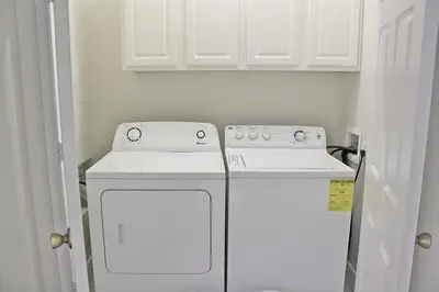 a kitchen with a white stove and a dishwasher at Windsor Hills Resort #102 in Orlando