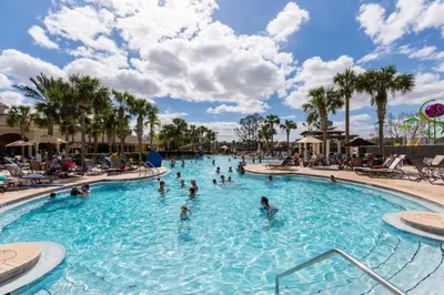 a group of people in a swimming pool at a resort at Windsor Hills Resort #102 in Orlando
