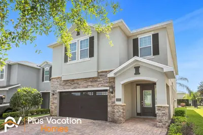 a large house with a garage at 7594 Oasis 8BD Villa- poolspa in Orlando