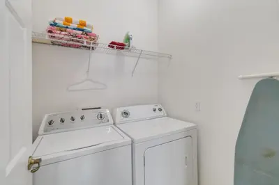 a kitchen with a white stove and a dishwasher at Huge Screened Patio That Overlooks Lake Buck, Near Famous Attractions!! in Orlando