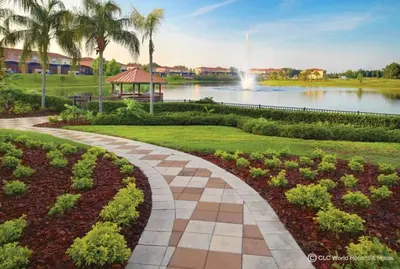 a walkway in a park with a lake and palm trees at *PRIVATE POOL* Disney10min - Magical Mickey themed home in Kissimmee