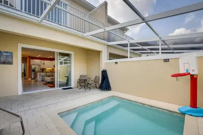 a swimming pool in a house with an indoor at Townhome with Lanai about 9 Mi to Disney! in Orlando