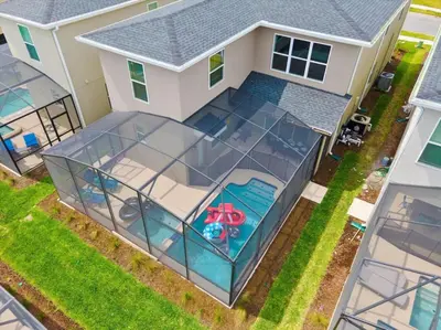 an overhead view of a house with a screened in patio at Modern Resort House Pool Wi-Fi Minutes to Disney in Kissimmee