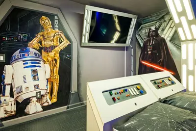a room with a star wars themed room with a television at Awesome new 8br w theme rooms theater by Disney in Kissimmee