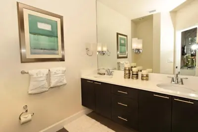 a bathroom with a sink and a mirror at Serenity 3 Bed 3 Bath Townhome With Pool, Private Balcony, Clubhouse, Communal Pool, Conservation View, Disney 15 Mins By Orlando Holiday Rental, in Orlando