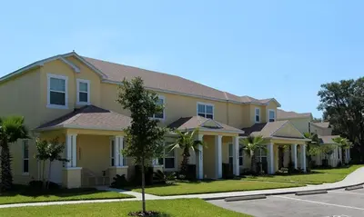 a row of houses on a street at Serenity 3 Bed 3 Bath Townhome With Pool, Private Balcony, Clubhouse, Communal Pool, Conservation View, Disney 15 Mins By Orlando Holiday Rental, in Orlando