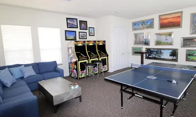 a living room with a ping pong table and ping pong balls at Serenity 3 Bed 3 Bath Townhome With Pool, Private Balcony, Clubhouse, Communal Pool, Conservation View, Disney 15 Mins By Orlando Holiday Rental, in Orlando