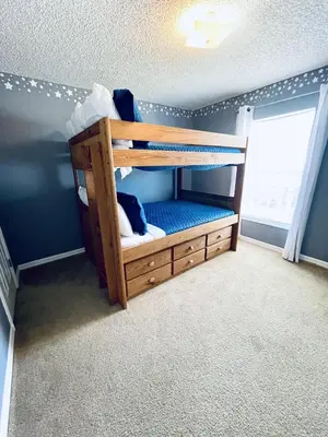 a bunk bed in a room with a window at Lakeside Community, Pools, And More! in Kissimmee