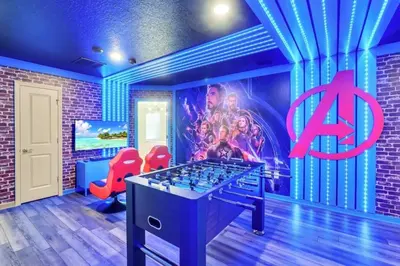 a room with a foosball table and a sign at Many Themes For Everyone 10 Huge Bedrooms! villa in Kissimmee