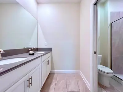 a bathroom with a sink and a toilet at Eight-Bedroom House in Kissimmee