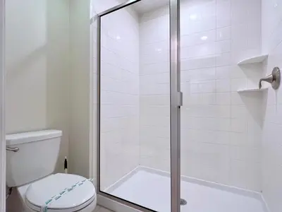 a bathroom with a shower with a toilet at Eight-Bedroom House in Kissimmee