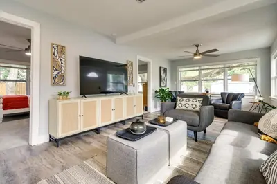 a living room with a couch and a tv at Dtwn Winter Garden Home 12 Mi to Disney! in Orlando