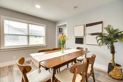a dining room with a wooden table and chairs at Dtwn Winter Garden Home 12 Mi to Disney! in Orlando