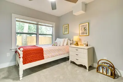 a bedroom with a bed and a window and a dresser at Dtwn Winter Garden Home 12 Mi to Disney! in Orlando