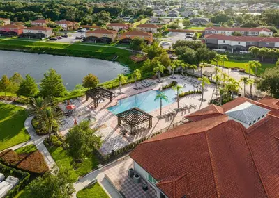 an aerial view of a resort with a swimming pool at Modern 6BR Home - Pool BBQ Hot Tub - Near Disney in Kissimmee
