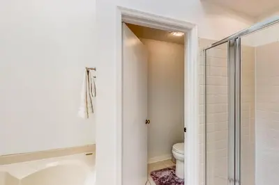 a bathroom with a toilet and a shower at Families with Pets! Home Near Orlando Theme Parks in Orlando