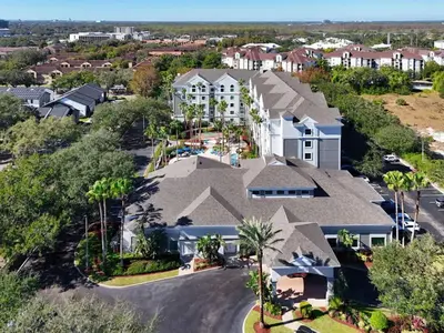 an aerial view of a residential neighborhood with houses at 1BR FREE Shuttle to Disney Parks HS305 in Orlando
