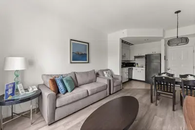 a living room with a couch and a table at 1BR FREE Shuttle to Disney Parks HS305 in Orlando