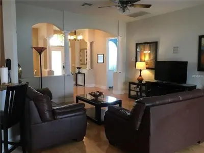 a living room with two couches and a tv at #472-Stunning 5 bed property with private south facing deck and pool in Orlando