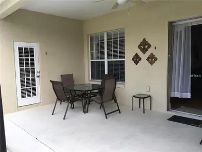 a dining room with a table and chairs at #472-Stunning 5 bed property with private south facing deck and pool in Orlando