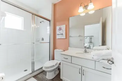 a bathroom with a shower and a toilet and a sink at 65 Home At Sonoma Resort, Private Pool, And Much More!! in Kissimmee